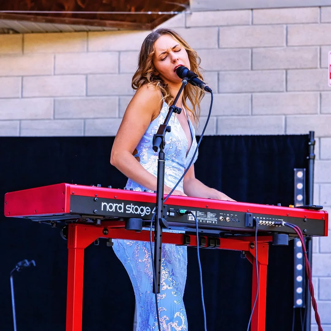 Awake & Dreaming's Sasha Kristoff performing at Railway City Music & Arts Festival